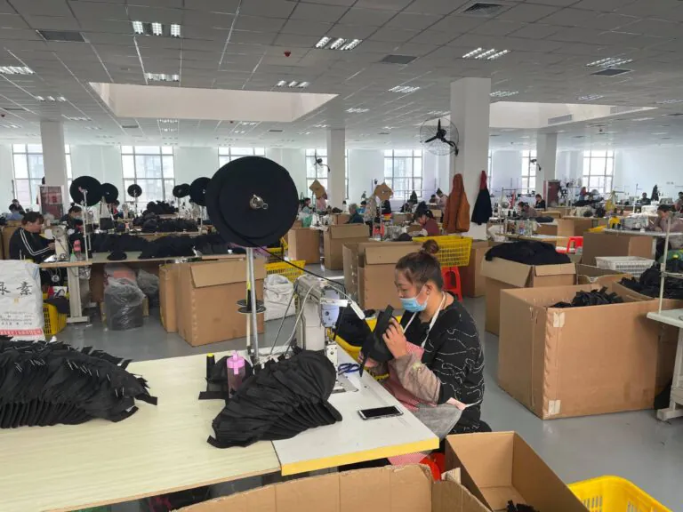 Anthea factory team working on custom headwear production