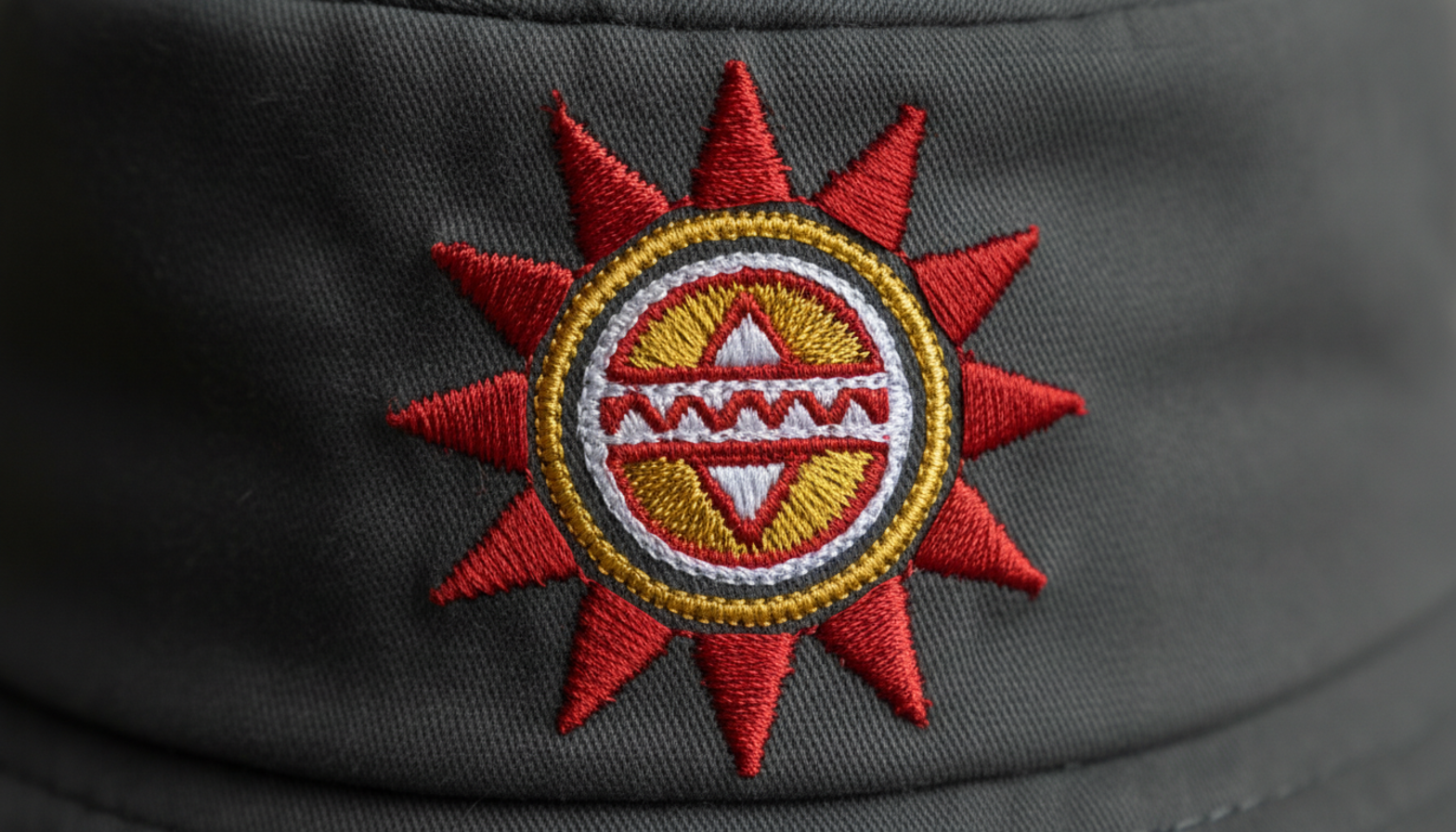 Close-up view of high-quality embroidery on bucket hat showing thread density and color precision