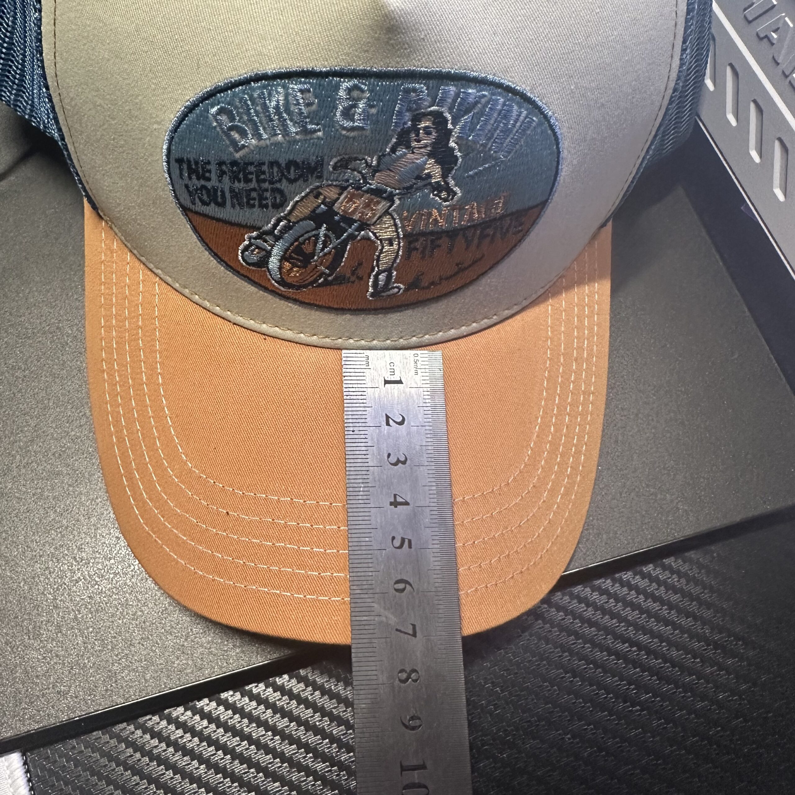 Quality inspector measuring cap dimensions with caliper