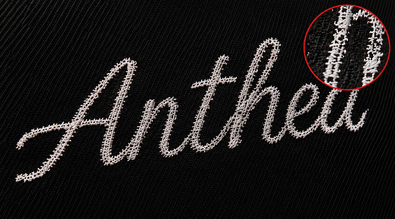 Low-quality embroidery showing sparse stitches with visible base fabric