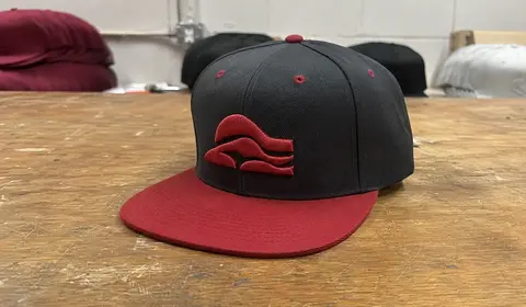 Custom snapback hat with 3D puff embroidery for streetwear brand and sports team