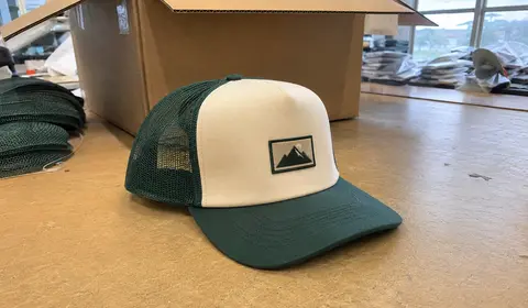 Custom trucker hat with mesh back and woven patch for outdoor brand and events