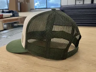 Custom trucker hat with mesh back and woven patch for outdoor brand
