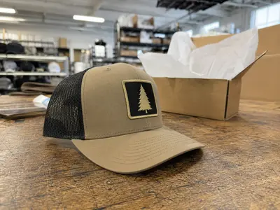 Custom trucker hat with woven patch for outdoor brand manufacturer