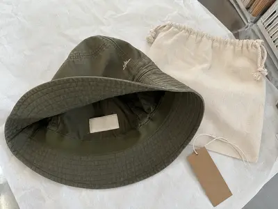 Private label bucket hat with custom woven label and packaging
