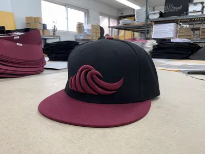 Custom snapback hat with 3D puff embroidery for streetwear brand